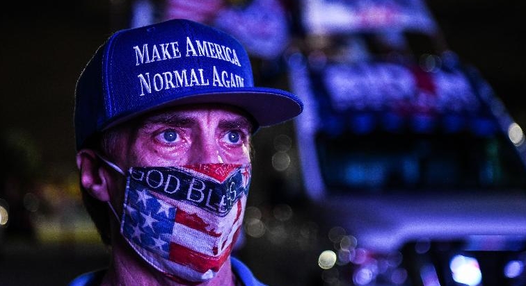 A supporter of the Democratic party attends a watch party in Miami, Florida. AFP