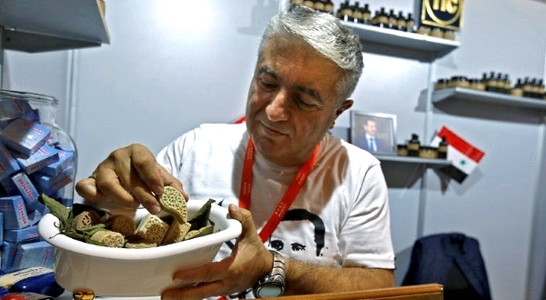 61-year-old soap maker Joseph Tobjian arranges Aleppo soap products. AFP 61-year-old soap maker Joseph Tobjian arranges Aleppo soap products. AFP