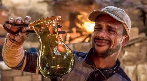 Glassblowers are among artisans bringing a part of Cairo's 'City of the Dead' back to life. AFP Glassblowers are among artisans bringing a part of Cairo's 'City of the Dead' back to life. AFP