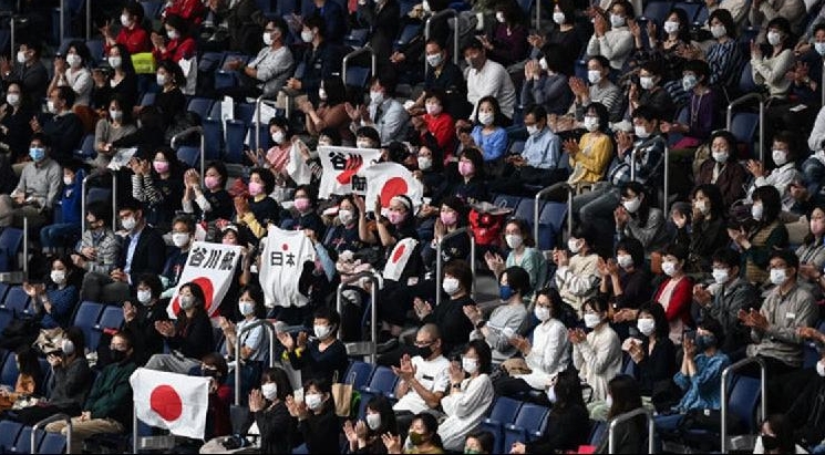 People attend the Friendship and Solidarity Competition gymnastics event in Tokyo on Nov 8, the first major international sporting event in the Japanese capital since the Tokyo 2020 Olympic Games was postponed due to the coronavirus pandemic. AFP People attend the Friendship and Solidarity Competition gymnastics event in Tokyo on Nov 8, the first major international sporting event in the Japanese capital since the Tokyo 2020 Olympic Games was postponed due to the coronavirus pandemic. AFP