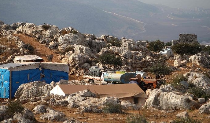 Tents housing Syrians displaced by war sit amidst the ruins at the UNESCO-listed site of Baqirha not far from the Turkish border. AFP Tents housing Syrians displaced by war sit amidst the ruins at the UNESCO-listed site of Baqirha not far from the Turkish border. AFP