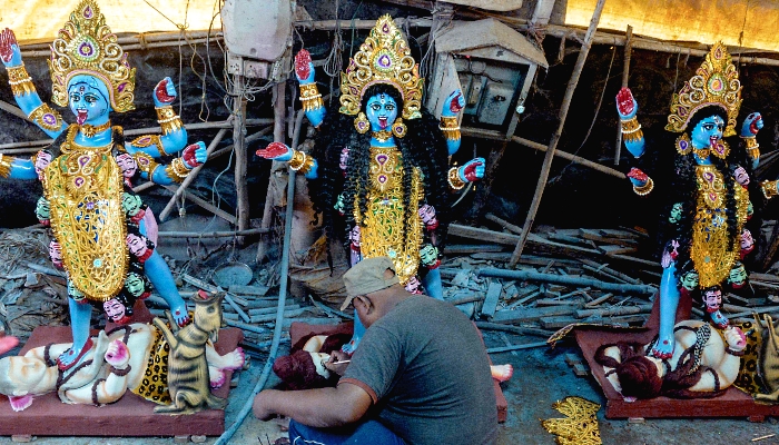 Artisans making idols of Hindu Goddess Kali at a workshop in Hyderabad, India, on the eve of the Diwali festival. AFP