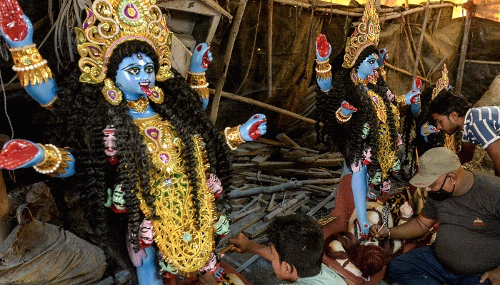 Artisans making idols of Hindu Goddess Kali at a workshop in Hyderabad, India, on the eve of the Diwali festival. AFP