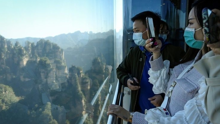The three double-decker elevators in Zhangjiajie Forest Park zip up the cliff in just 88 seconds. AFP
