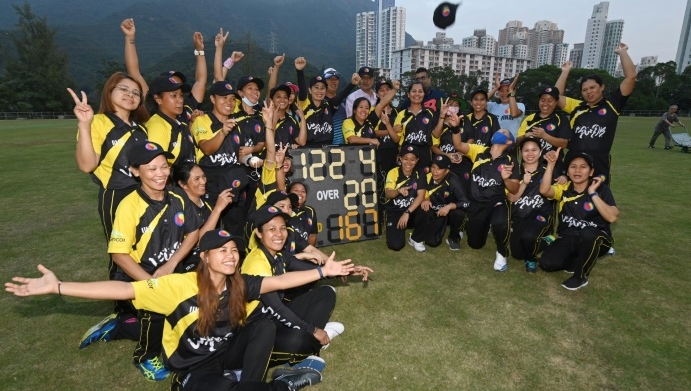 The SCC Divas Cricket Team, made up of domestic helpers from the Philippines, celebrate their latest win against the Hong Kong Cricket Club Cavaliers. AFP