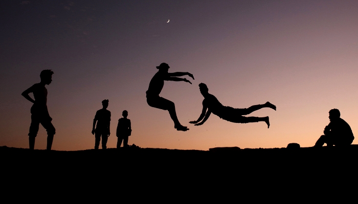 Palestinian youths practice parkour in Gaza City. AFP