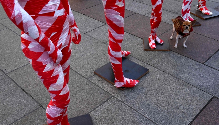 Mannequins wrapped in red and white flutter tape installed at the Marienplatz in Munich, southern Germany. AFP