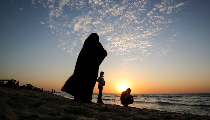 Palestinians enjoy the beach in Gaza City. AFP