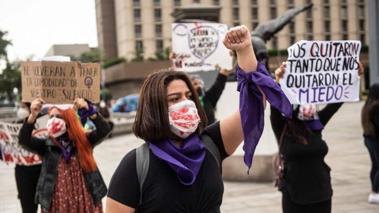 Demonstrators protest the gang rape of a 21-year-old woman in front of the Justice Ministry in Lima, Peru. AFP