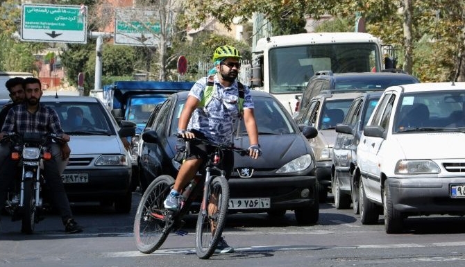 32-year-old chef Farshad Rezayi rides over 30km a day to get to and from work. AFP