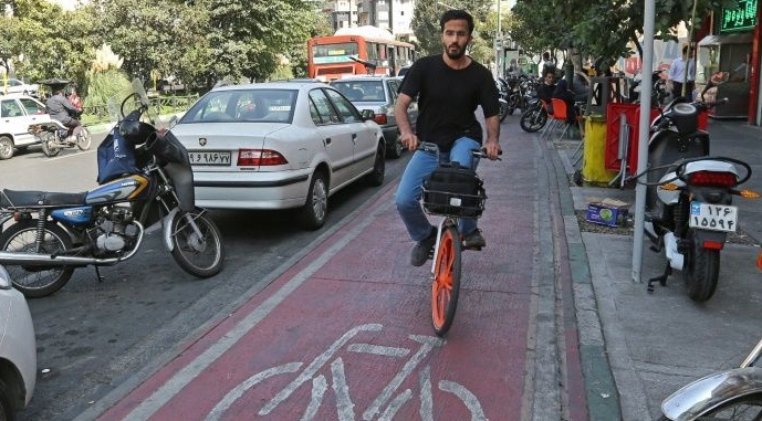 A man rides a bicycle from bike-sharing service Bdood in Tehran. AFP A man rides a bicycle from bike-sharing service Bdood in Tehran. AFP