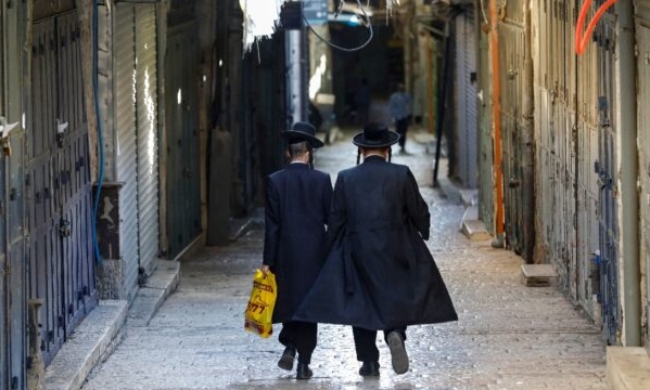Lockdowns and restrictions on gatherings aimed at halting the virus' spread in Israel have shaken the rhythm of life for ultra-Orthodox Jews, pushing them to integrate in the world outside. AFP