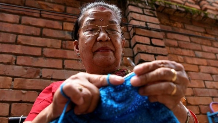 Champa Devi Tuladhar's hand-knitted socks inspired her granddaughter to set up a crafts venture that not only sells such handmade products but also delves into the seldom-told lives of their mostly elderly female creators. AFP