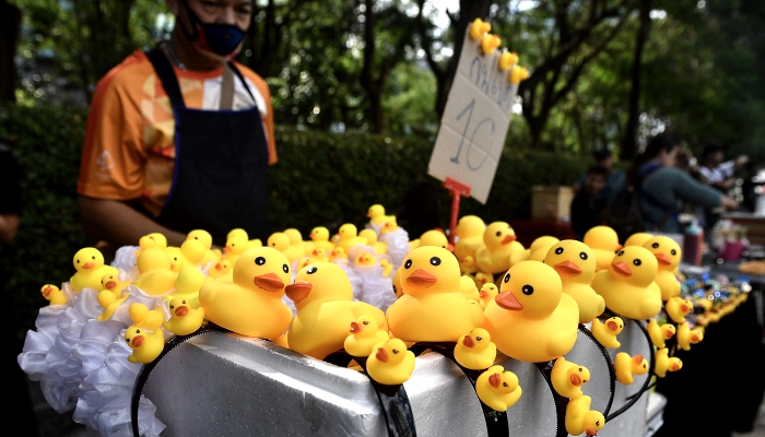 Hairbands with little rubber duck figures for sale at the site of an anti-government rally outside Siam Commercial Bank main office in Bangkok. AFP