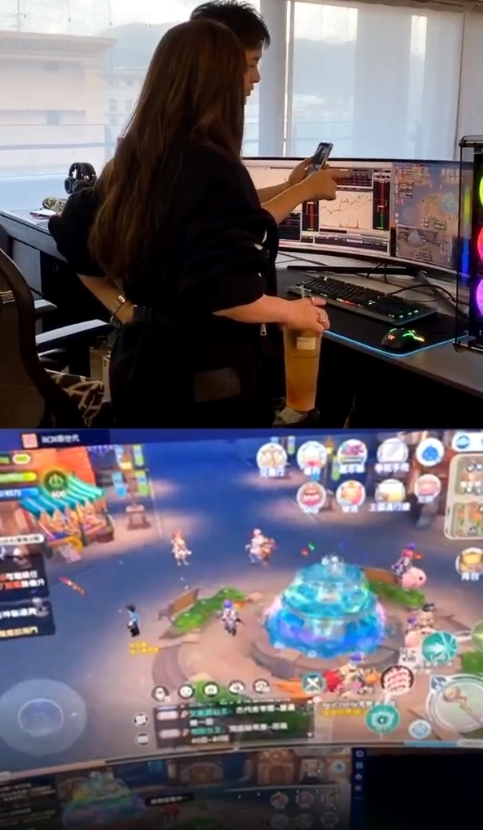 林志颖在电脑工作区一边打网络游戏，一边观察股市。

