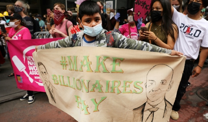 A protest calling for higher taxes on the rich in New York. A protest calling for higher taxes on the rich in New York.