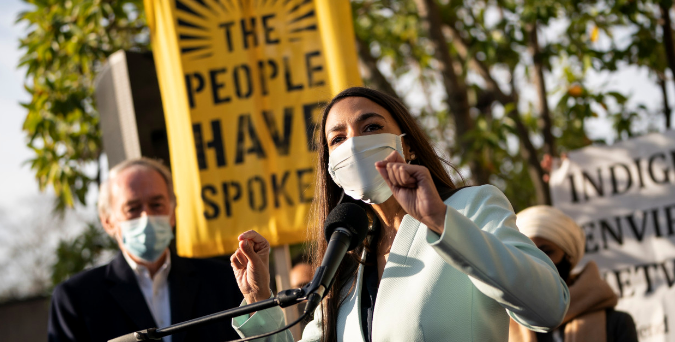 US Rep Alexandria Ocasio-Cortez speaks outside of the Democratic National Committee headquarters in Washington, DC, calling on the incoming Biden administration to take bold action on issues of climate change and economic inequalities. AFP US Rep Alexandria Ocasio-Cortez speaks outside of the Democratic National Committee headquarters in Washington, DC, calling on the incoming Biden administration to take bold action on issues of climate change and economic inequalities. AFP
