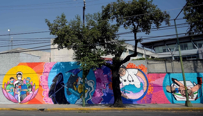 Murals painted by students and professors from the Faculty of Arts and Design of National Autonomous University of Mexico (UNAM) to honor health workers fighting the coronavirus on the walls of the National School of Nursing and Obstetrics in Mexico City. AFP