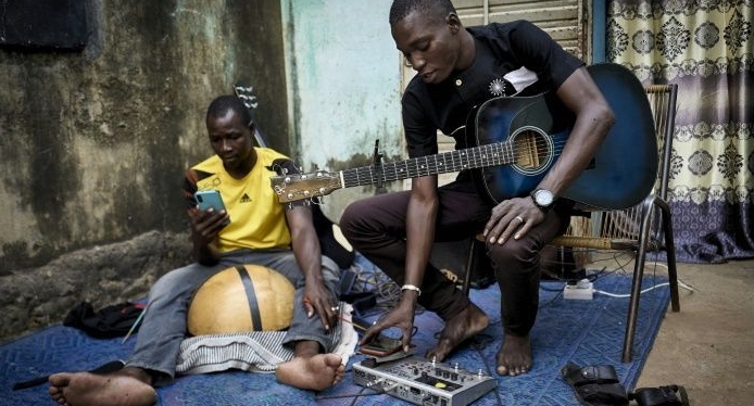Ali Traore (R) works with Sahel Sounds, a record label specializing in Africa's semi-arid Sahel. AFP