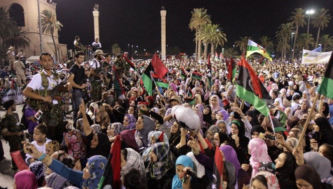 Libyans celebrate during the speech of Mustafa Abdul Jalil, Chairman of the Libyan Transitional Council, at the Martyrs' Square in Tripoli on Sept 13, 2011. AFP