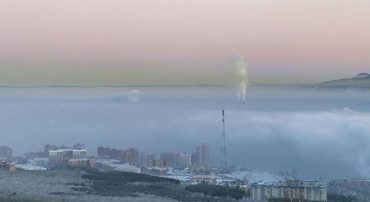 Pollution over the Russian industrial city of Krasnoyarsk. AFP Pollution over the Russian industrial city of Krasnoyarsk. AFP