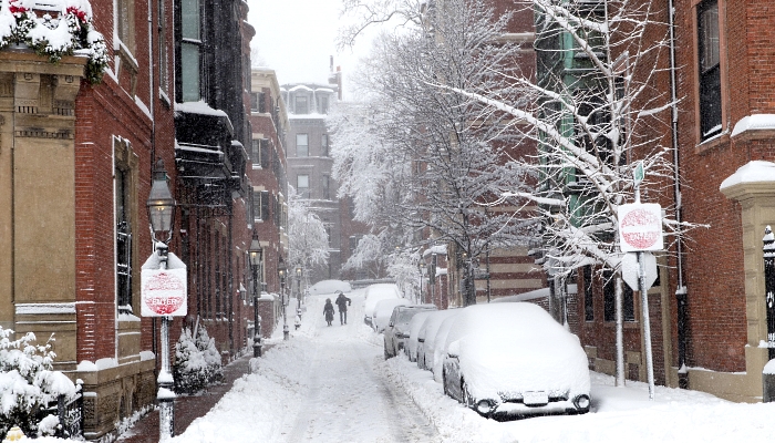 Pedestrians walk down Spruce Street in Boston, Massachusetts. AFP