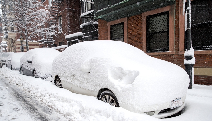 Snow covers the cars on Spruce Street in Boston, Massachusetts. AFP