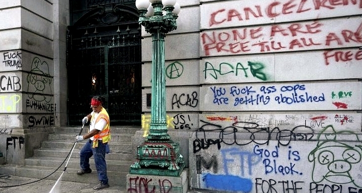 Graffiti being cleaned up in New York. AFP