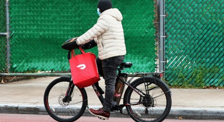 A DoorDash delivery worker in New York. AFP