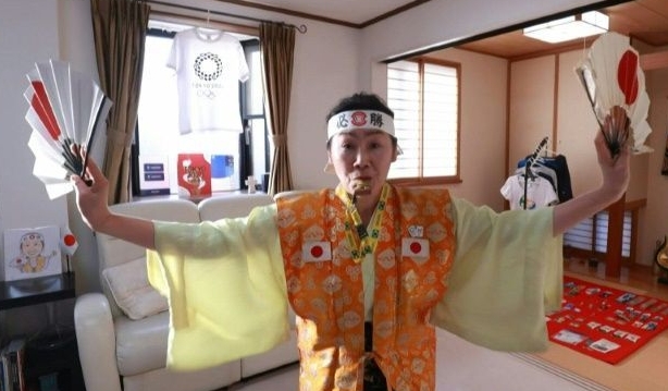 Olympic super-fan determined to welcome world to Tokyo. AFP