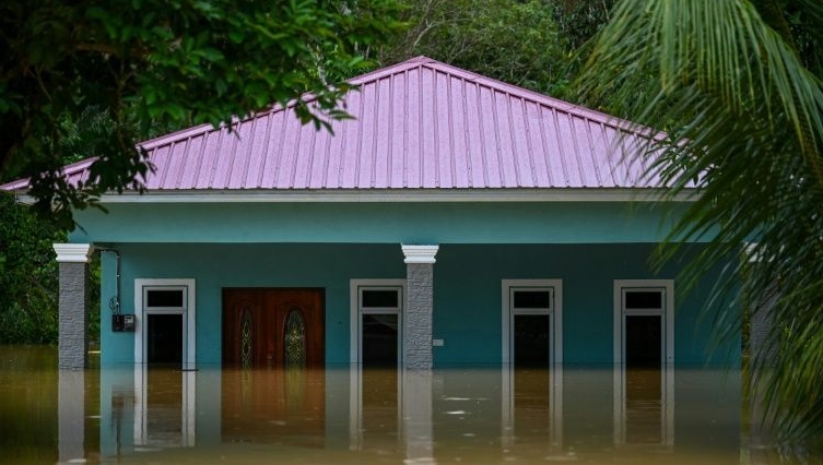 A house is seen partially submerged in Semantan, Pahang. AFP