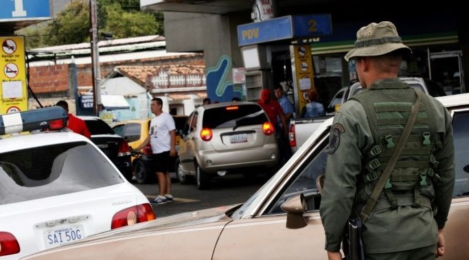 Venezuela's military control the country's gas stations -- taxi drivers complain that this gives soldiers moonlighting as drivers for extra cash an unfair advantage. AFP