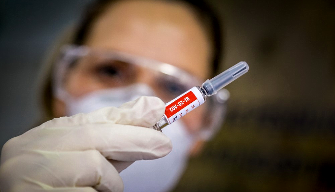 A nurse shows a COVID-19 vaccine produced by Sinovac Biotech at the Sao Lucas Hospital in Porto Alegre. AFP