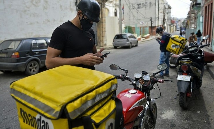 The arrival of mobile internet in Cuba two years ago has enabled the creation of businesses such as Mandao, an app-based home delivery company. AFP