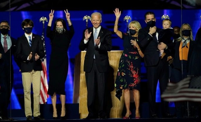 Biden with his wife Jill and members of their family salute the crowd in Wilmington, Delaware, on Nov 7. AFP