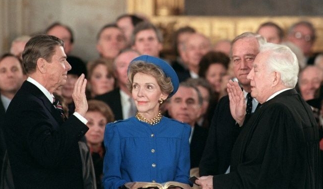 Ronald Reagan sworn in by Chief Justice Warren Burger beside his wife Nancy Reagan in the Capitol Rotunda in 1985. AFP