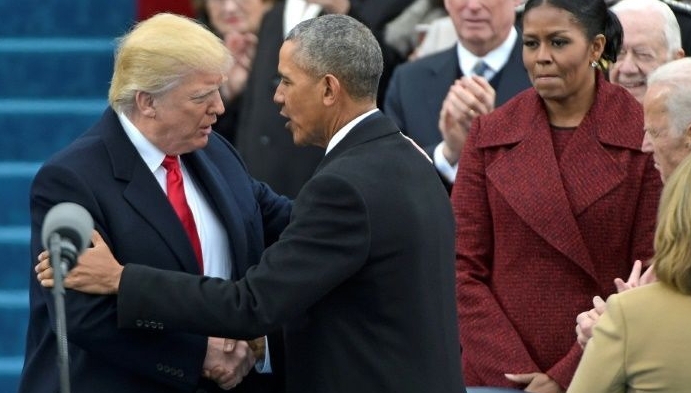 Barack Obama greets Donald Trump as he arrives on the platform at the US Capitol in Washington, DC for his swearing-in ceremony in January 2017. AFP