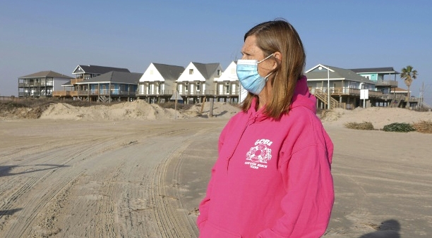 Toni Capretta, president of the Save Our Beach association, looks on during Dunes Day at Surfside Beach, Texas. AFP