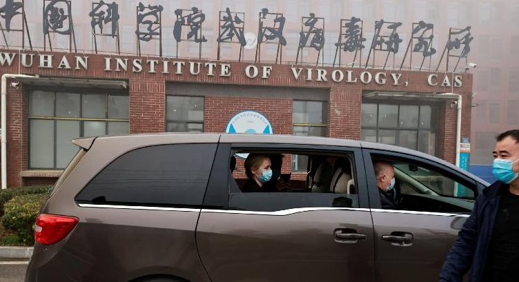 Members of the WHO team arrive at the Wuhan Institute of Virology.