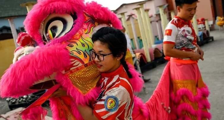 Lion dances are physically demanding, requiring agility and power to excel at the traditional sport. AFP