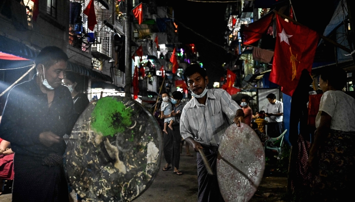 People taking part in a noise campaign in Yangon, Myanmar, following calls for protest against the military coup on the social media. AFP