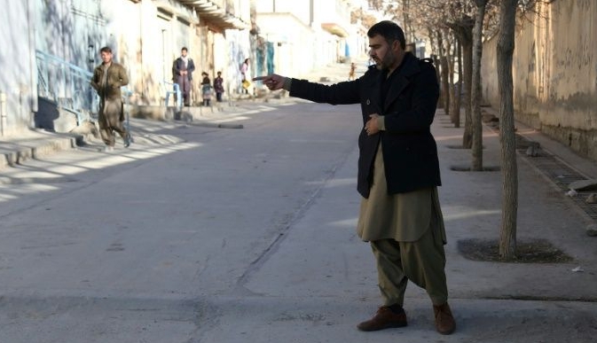 Abdul Baqi Rasheed points to the spot where his brother, activist Mohammad Yousuf Rasheed, was shot dead in Kabul. AFP