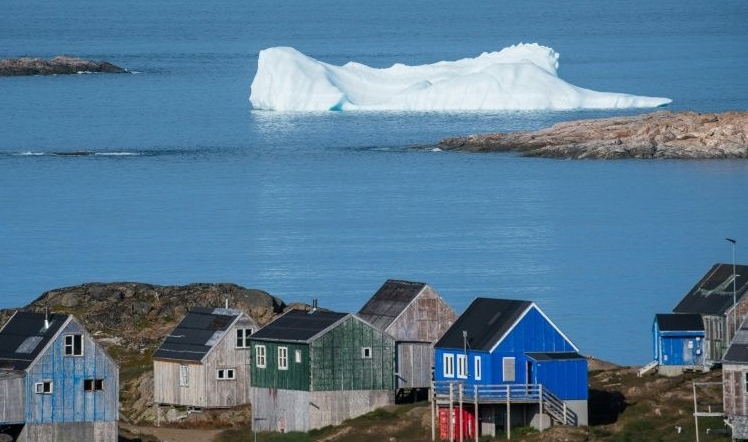 Icebergs float beyond the town of Kulusuk in Greenland. AFP