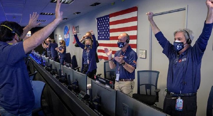 Members of NASA's Perseverance rover team react in mission control after receiving confirmation the spacecraft successfully touched down on Mars. AFP/NASA Members of NASA's Perseverance rover team react in mission control after receiving confirmation the spacecraft successfully touched down on Mars. AFP/NASA