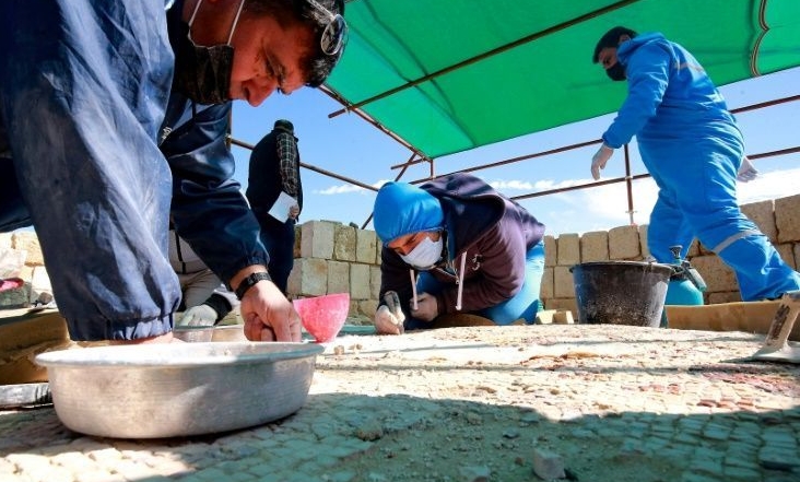 The painstaking restoration work has generated employment for locals and for Syrian refugees. AFP