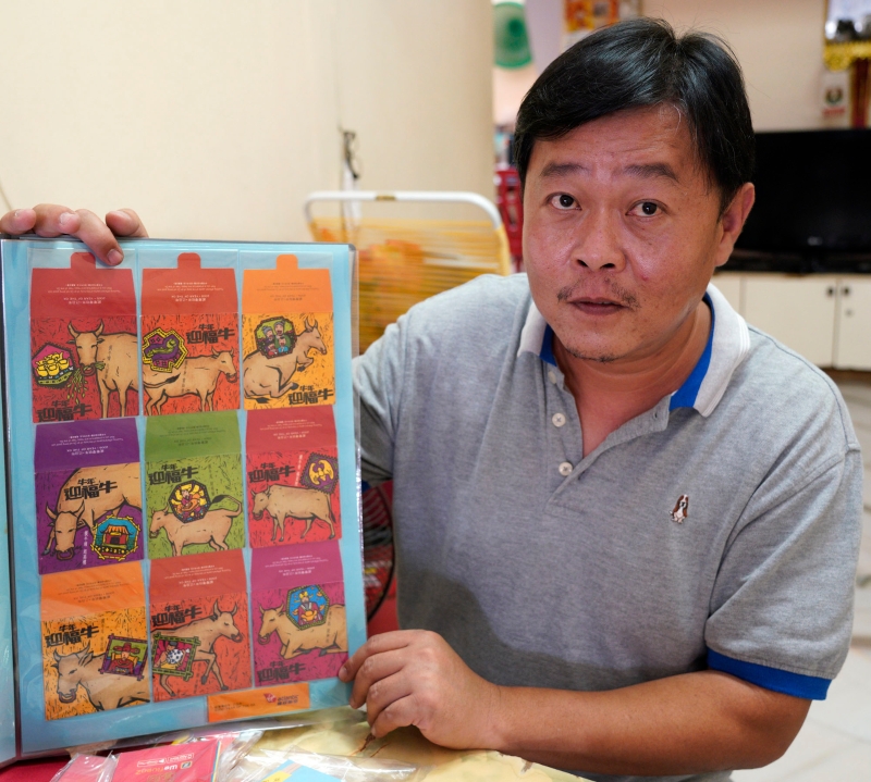 吴华安也有收集到寓意吉祥的牛图红包封。