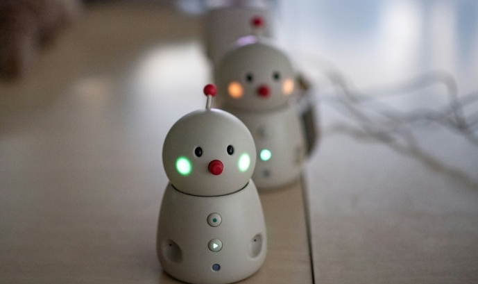 The Bocco emo robots (front and middle) allow families to leave and send voice messages through their phones. AFP