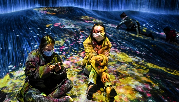 People visiting a teamLab Borderless exhibition in Shanghai, China. AFP