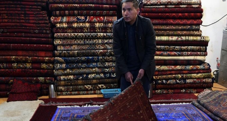 Chari Allahqul began carpet hunting as a child and was once clubbed with a Kalashnikov by bandits. AFP