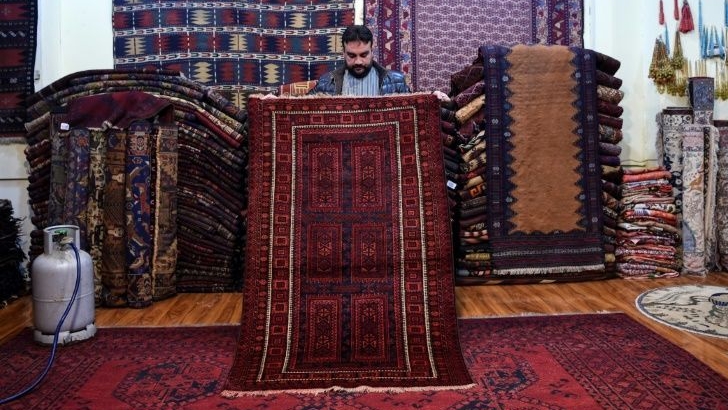 Afghanistan's rug hunters can spend weeks or months passing through villages like sleuths along old caravan trails. AFP